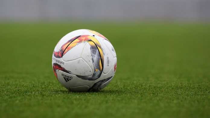A ball on a soccer field A ball on a soccer field