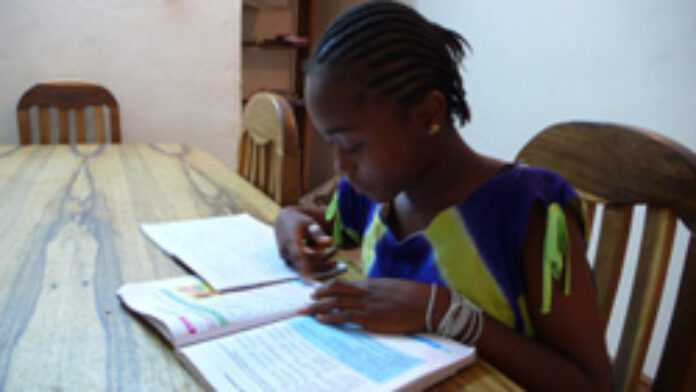 Ruth, 13 doing homework Ruth, 13 doing homework