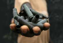 Of child soldiers and obscene systems Hand of a child